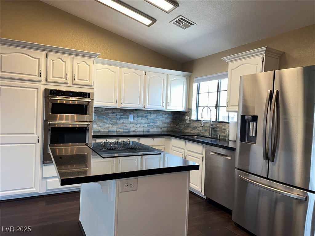 305 Ridge Road Boulder City, NV 89005 - Photo 4 of 30 Kitchen with lofted ceiling, a sink, stainless ste