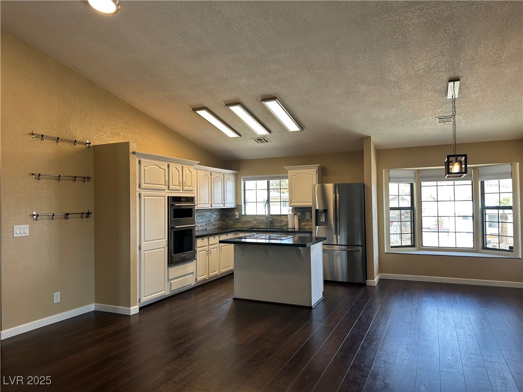 305 Ridge Road Boulder City, NV 89005 - Photo 5 of 30 Kitchen featuring dark wood-style floors, dark cou
