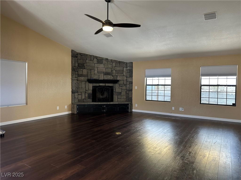 305 Ridge Road Boulder City, NV 89005 - Photo 6 of 30 Unfurnished living room with baseboards, visible v