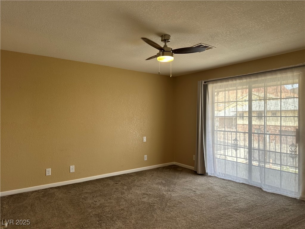 305 Ridge Road Boulder City, NV 89005 - Photo 7 of 30 Spare room featuring a ceiling fan, carpet, basebo