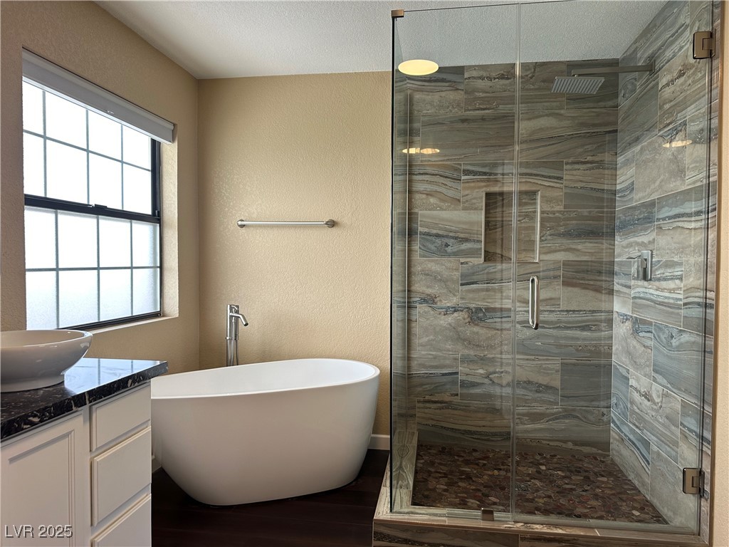 305 Ridge Road Boulder City, NV 89005 - Photo 8 of 30 Full bath with a textured wall, a freestanding tub