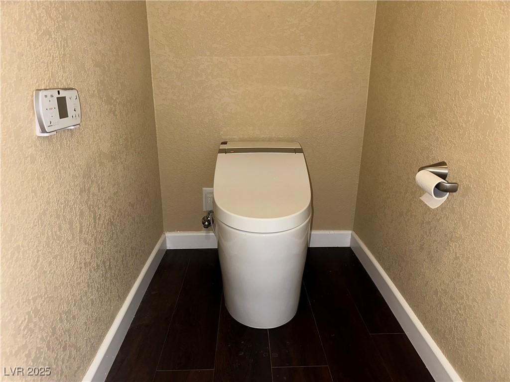 305 Ridge Road Boulder City, NV 89005 - Photo 10 of 30 Bathroom with baseboards, toilet, wood finished fl