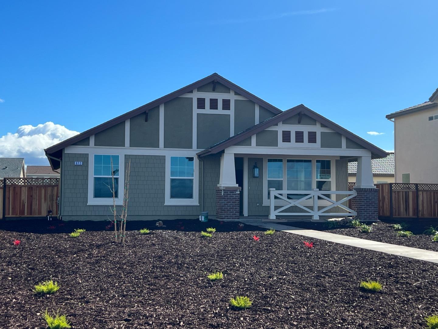672 Bikle Drive King City, CA 93930 - Photo 2 of 39 a front view of a house with garden