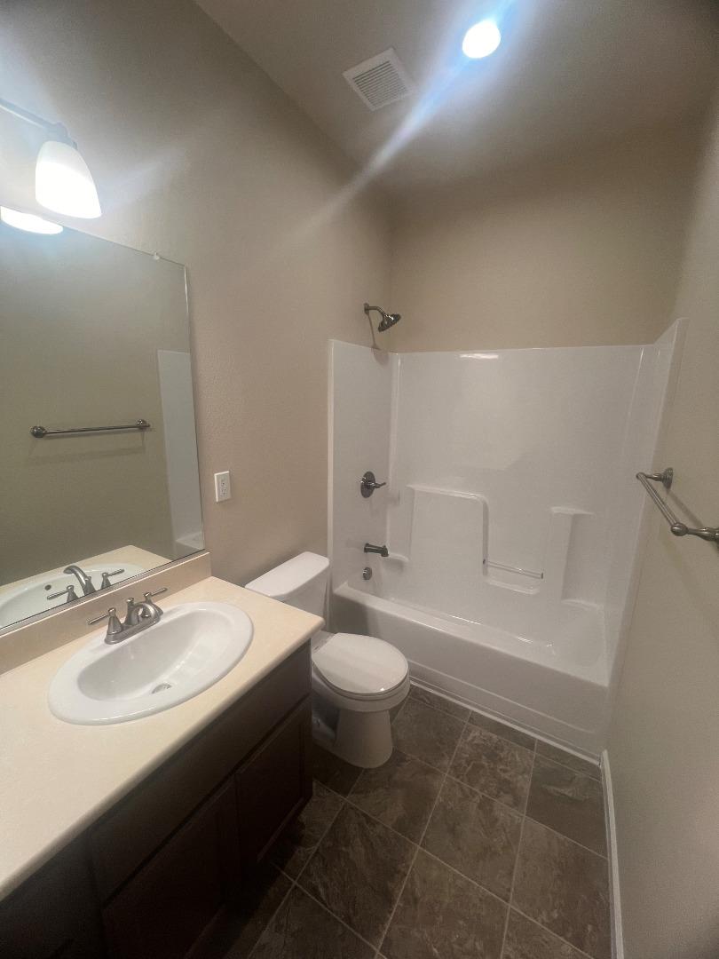 672 Bikle Drive King City, CA 93930 - Photo 26 of 39 a bathroom with a sink toilet and shower