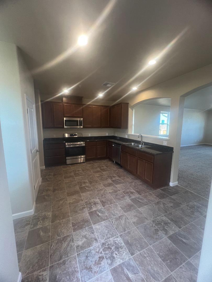 672 Bikle Drive King City, CA 93930 - Photo 29 of 39 a room with a wooden floor and a sink