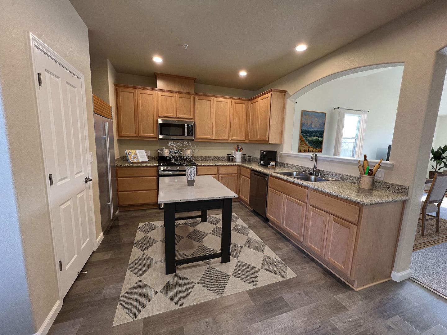 672 Bikle Drive King City, CA 93930 - Photo 5 of 39 a kitchen with sink cabinets and living room