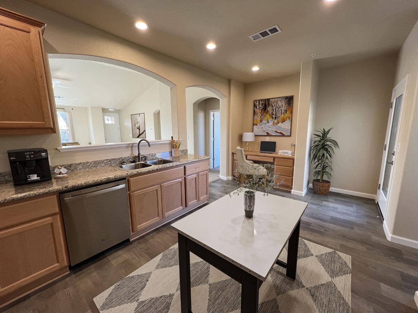 672 Bikle Drive King City, CA 93930 - Photo 6 of 39 a kitchen with sink cabinets and dining table