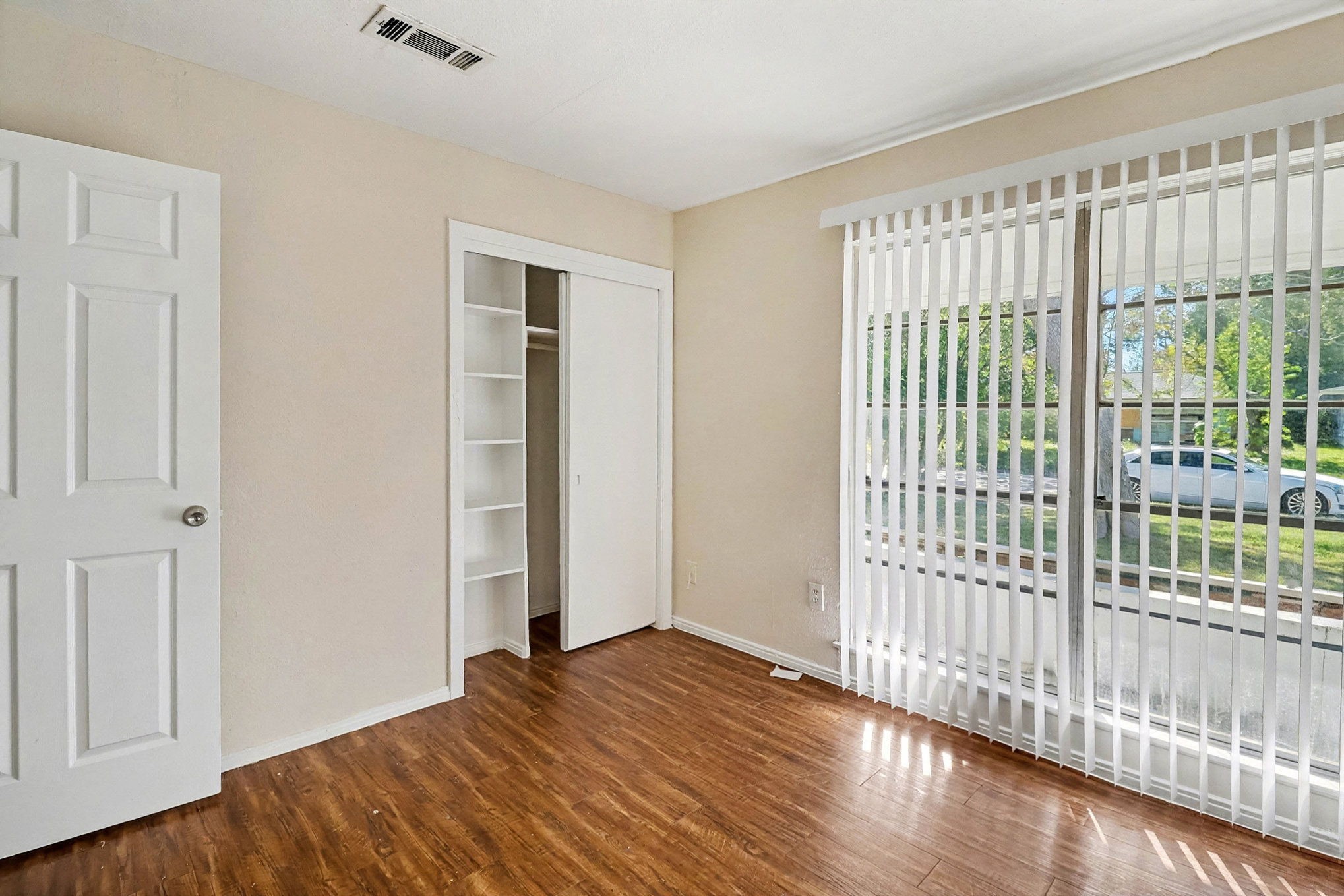 5711 Ridgeway Drive Houston, TX 77033 - Photo 26 of 29 a view of empty room with wooden floor