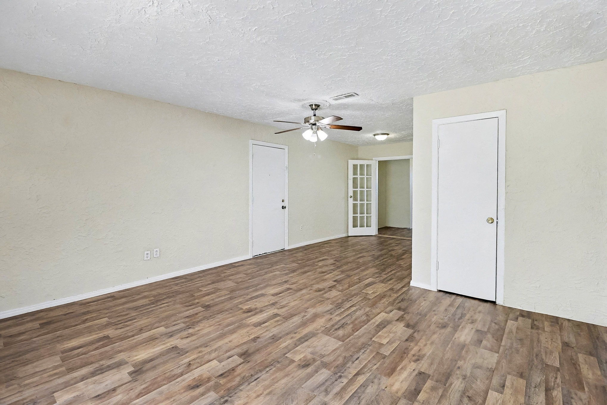 5711 Ridgeway Drive Houston, TX 77033 - Photo 8 of 29 wooden floor in an empty room