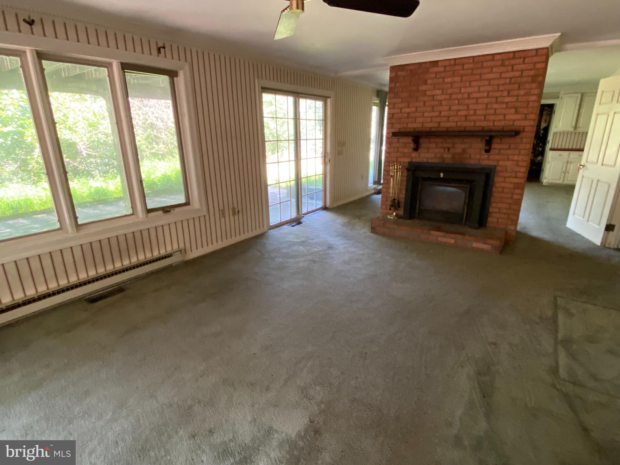1 Sunset Drive Lavale, MD 21502 - Photo 13 of 21 an empty room with fireplace and windows