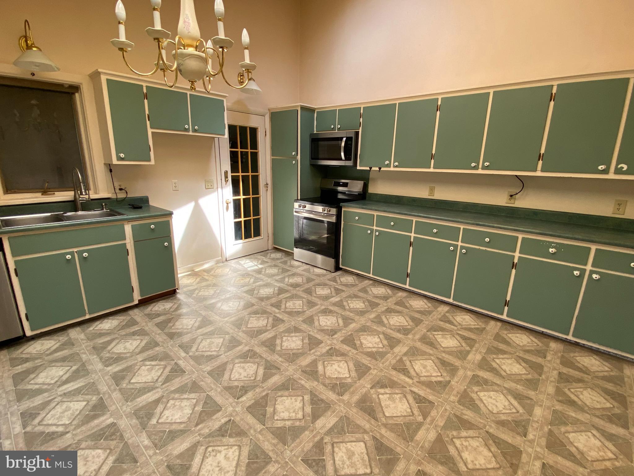 1 Sunset Drive Lavale, MD 21502 - Photo 6 of 21 a kitchen with a refrigerator and a sink