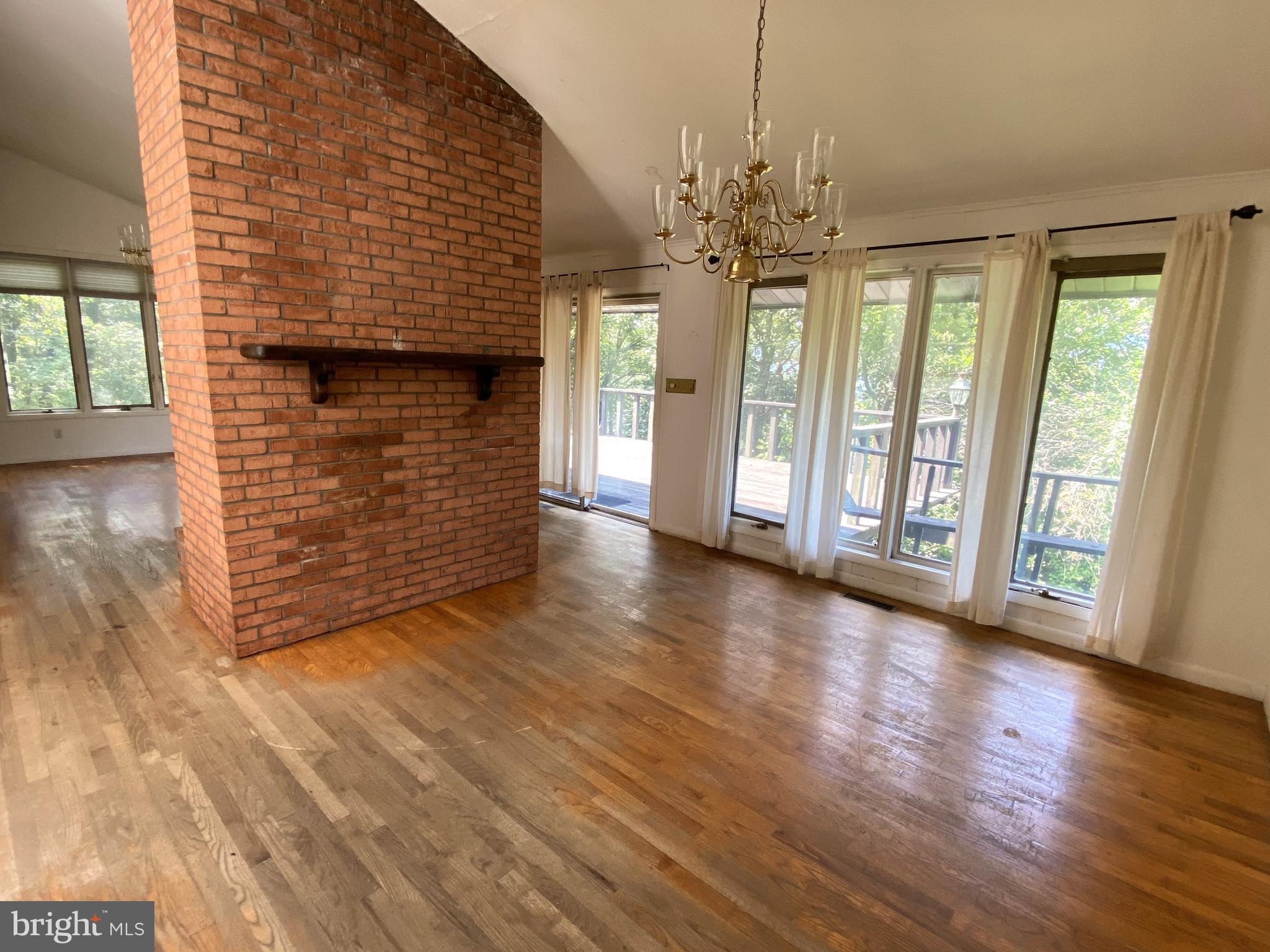 1 Sunset Drive Lavale, MD 21502 - Photo 7 of 21 a view of an empty room with wooden floor and a window