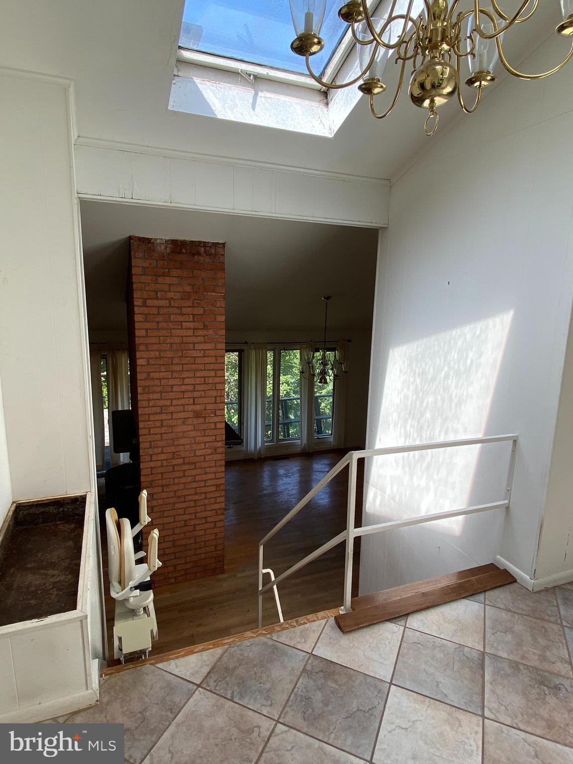 1 Sunset Drive Lavale, MD 21502 - Photo 10 of 21 a room with stairs and a chandelier