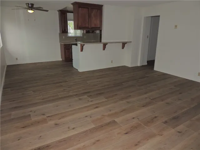 a view of kitchen with wooden floor