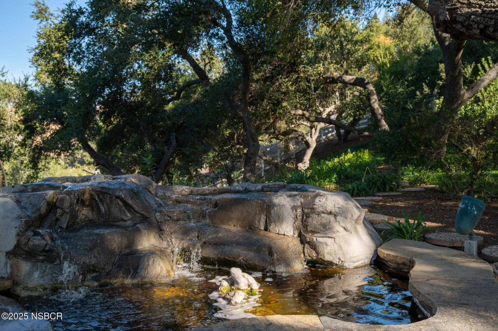 4086 East Oak Trail Road Santa Ynez, CA 93460 - Photo 20 of 57 a view of a backyard with plants and a patio