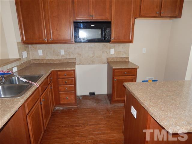 2948 Casona Way Raleigh, NC 27616 - Photo 2 of 11 a kitchen with stainless steel appliances granite countertop a sink stove and cabinets