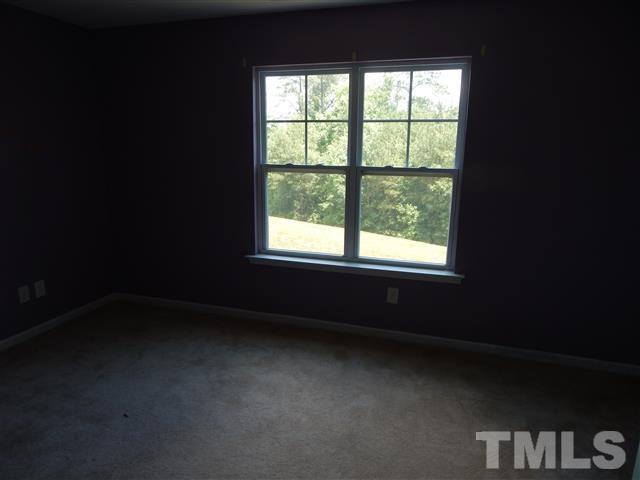 2948 Casona Way Raleigh, NC 27616 - Photo 5 of 11 a view of an empty room with a window