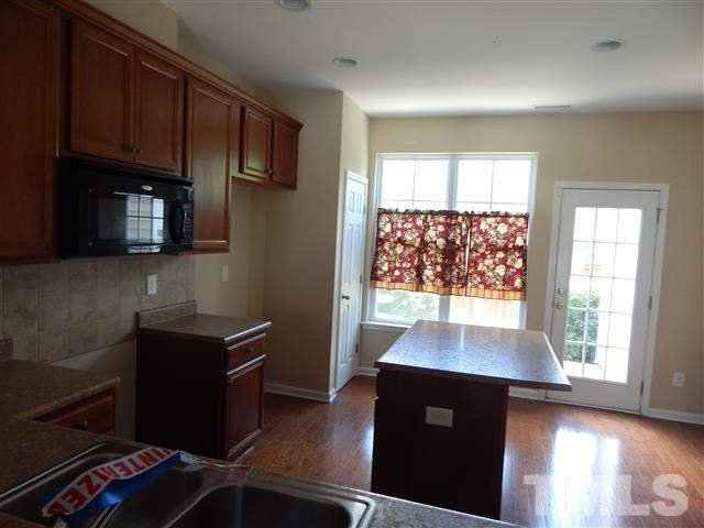 2948 Casona Way Raleigh, NC 27616 - Photo 9 of 11 a view of kitchen with windows and refrigerator