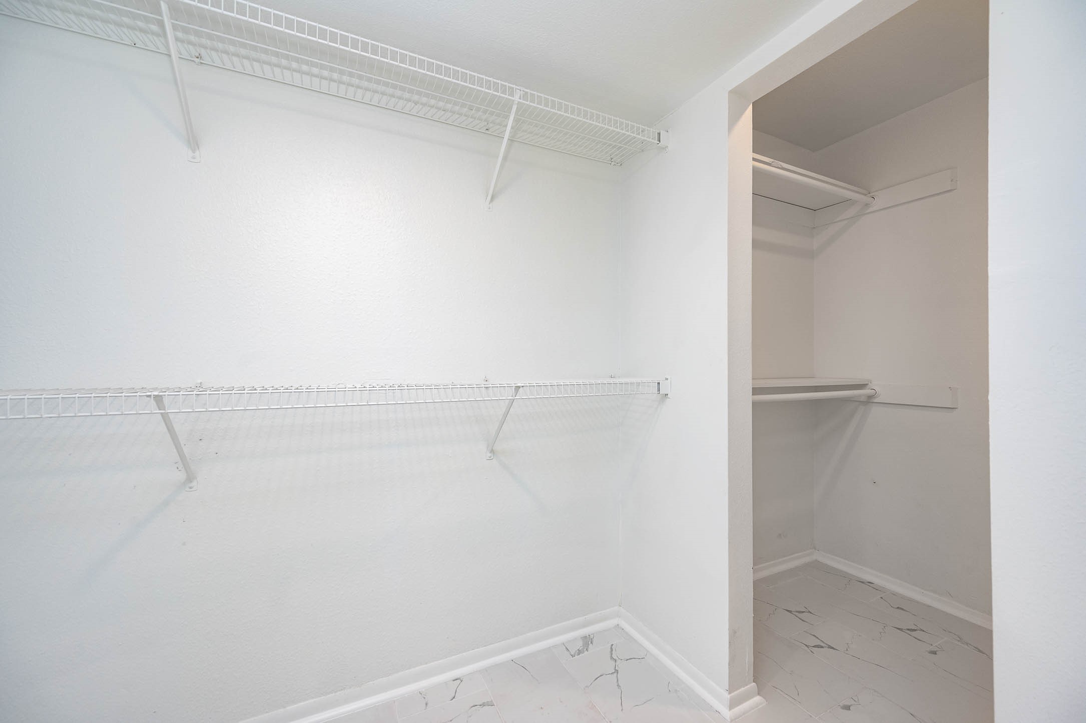 1616 Redway Lane Houston, TX 77062 - Photo 15 of 48 a view of walk in closet with empty racks