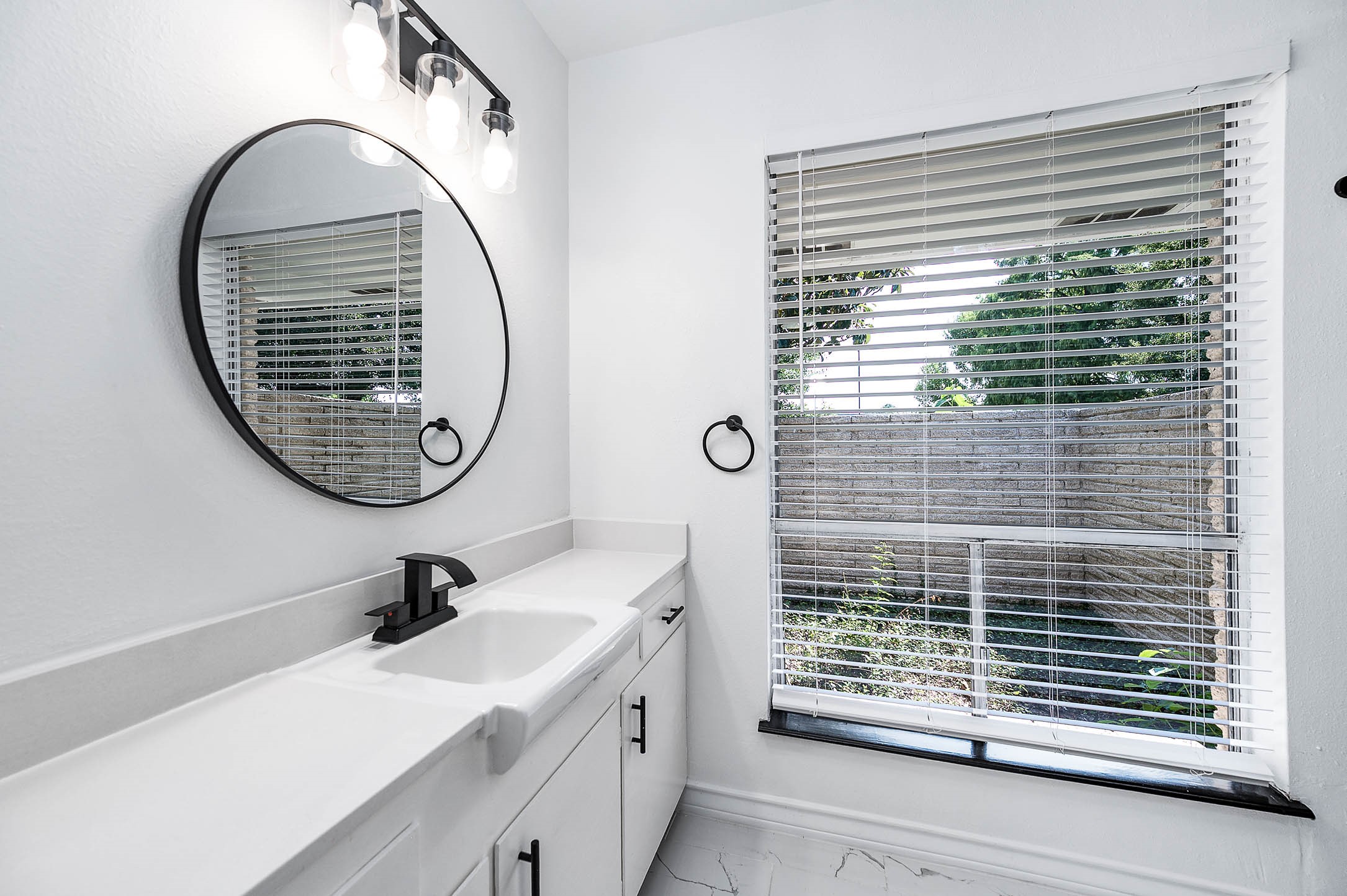 1616 Redway Lane Houston, TX 77062 - Photo 16 of 48 a bathroom with a sink and a mirror
