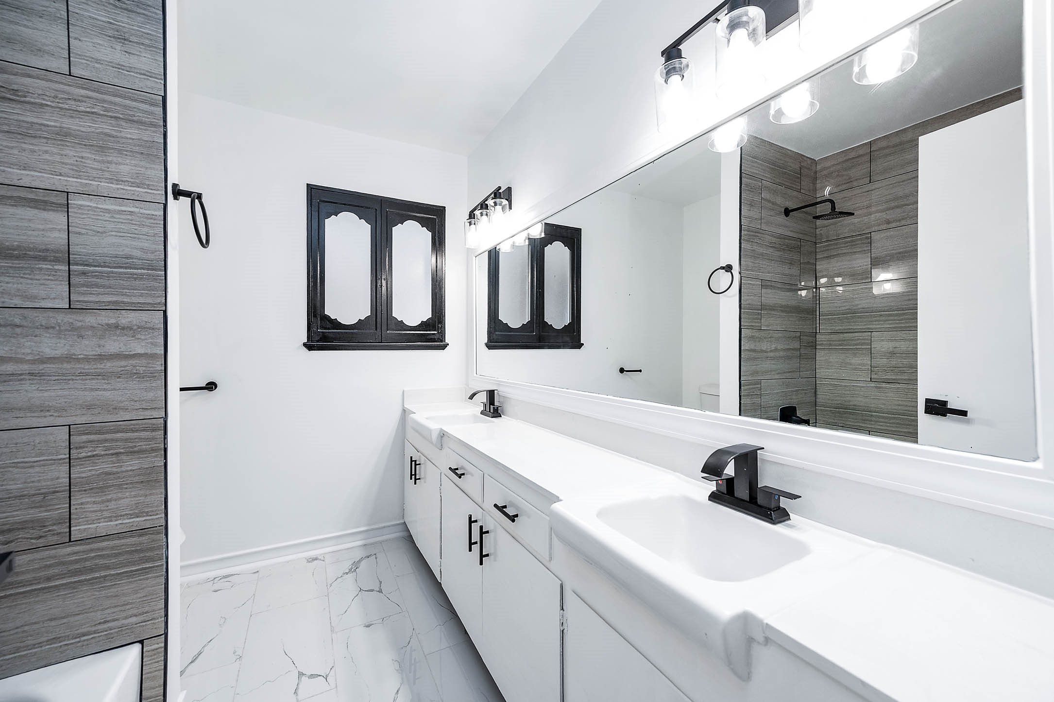 1616 Redway Lane Houston, TX 77062 - Photo 22 of 48 a bathroom with a double vanity sink mirror and bathtub