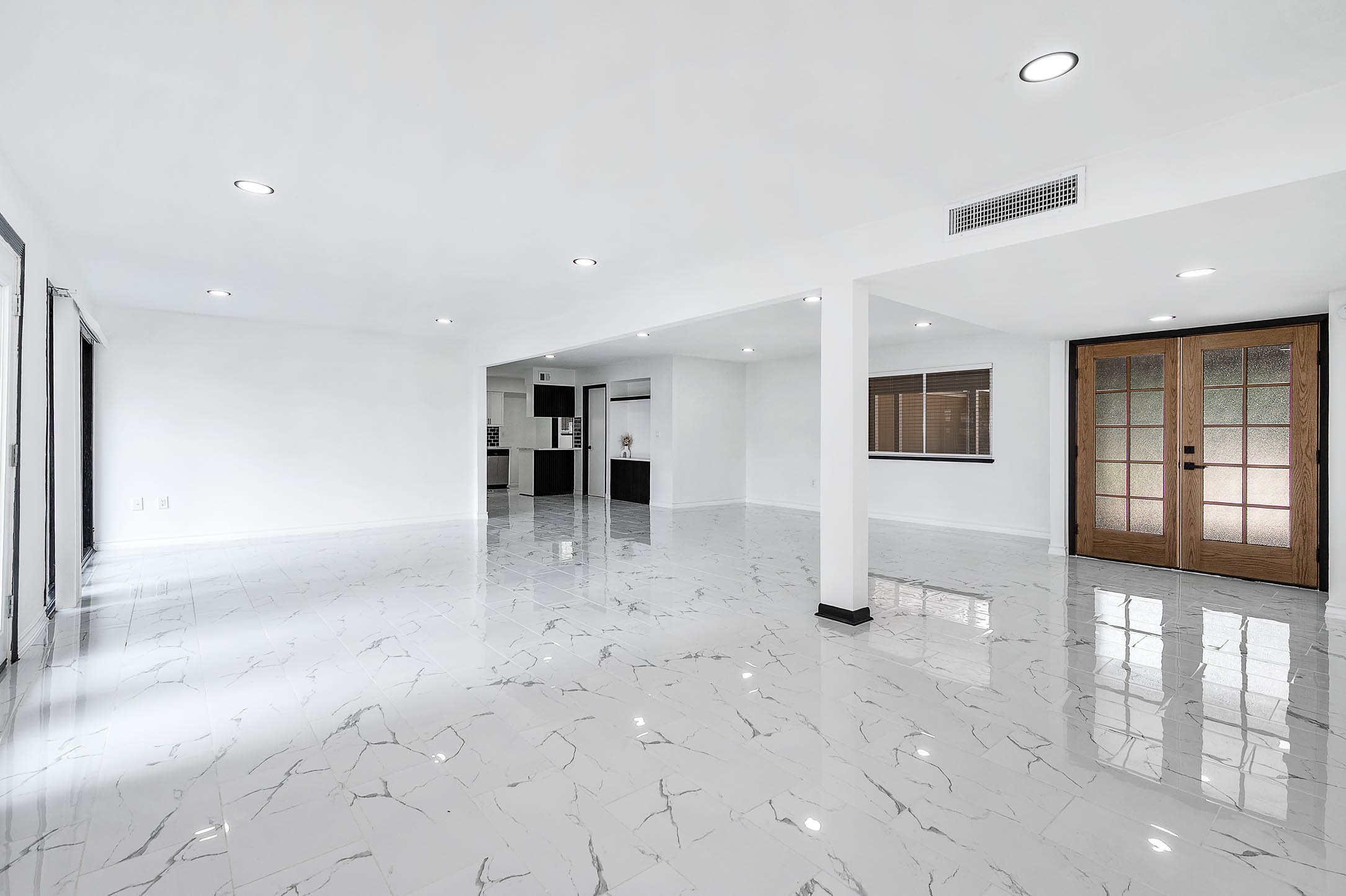 1616 Redway Lane Houston, TX 77062 - Photo 5 of 48 a view of a hallway with wooden floor and windows