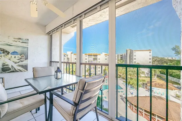 a view of a balcony with furniture
