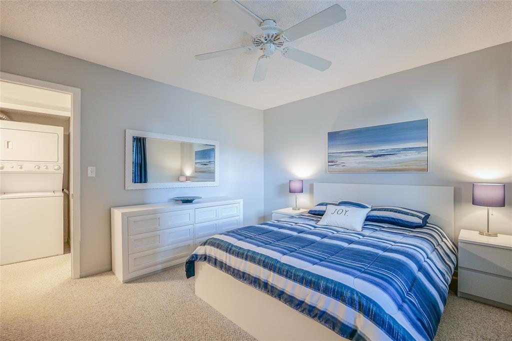 3920 Inverrary Boulevard, Unit 604C Lauderhill, FL 33319 - Photo 18 of 54 a bedroom with a bed and a chandelier