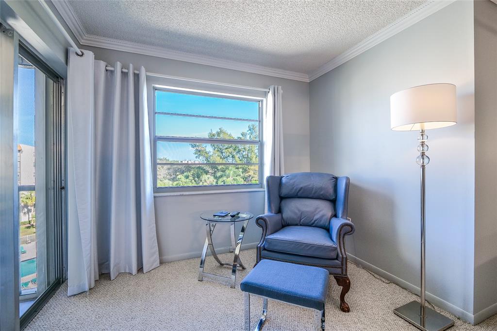 3920 Inverrary Boulevard, Unit 604C Lauderhill, FL 33319 - Photo 26 of 54 a living room with furniture and a window