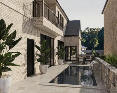 a view of a house with backyard porch and sitting area