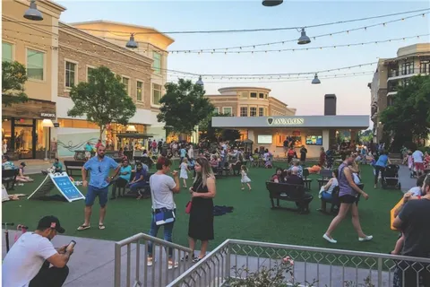 a view of street with sitting area