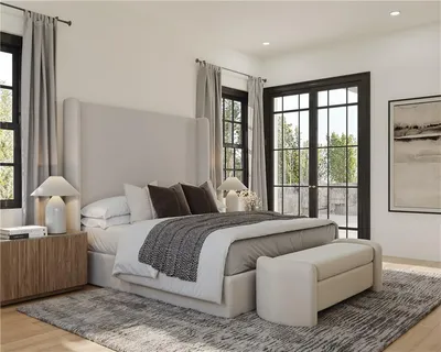 a bedroom with a bed and a large window