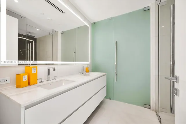 a bathroom with a bathtub and shower