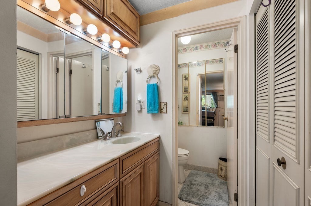 147 Sylvan Street, Unit 18B Danvers, MA 01923 - Photo 19 of 24 a bathroom with a sink a toilet and shower