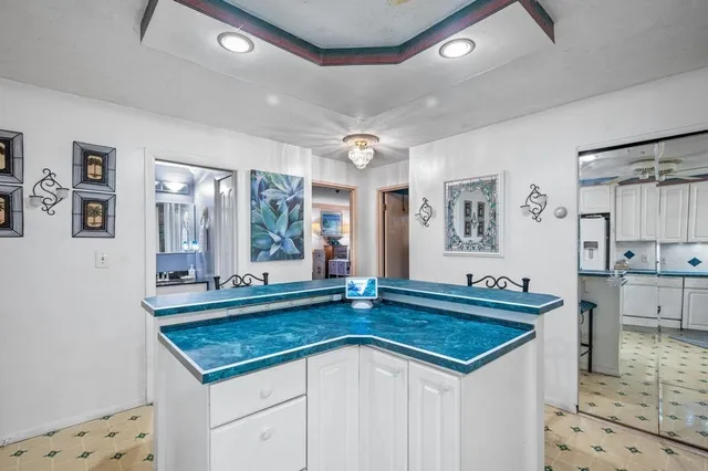 a kitchen with granite countertop a sink and a stove
