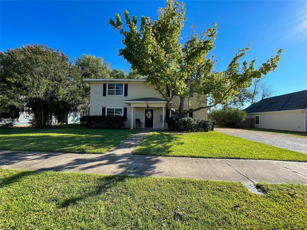1016 West Gandy Street, Unit 4 Denison, TX 75020 - Photo 1 of 11 a view of a house with a yard