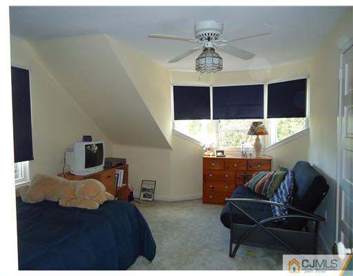 84 Rector Street Metuchen, NJ 08840 - Photo 8 of 10 a bedroom with furniture and a window