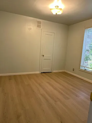 an empty room with a windows