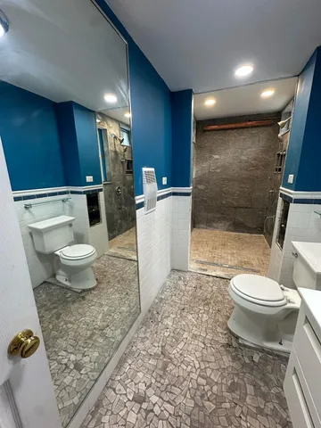a bathroom with a toilet a sink and a bathtub