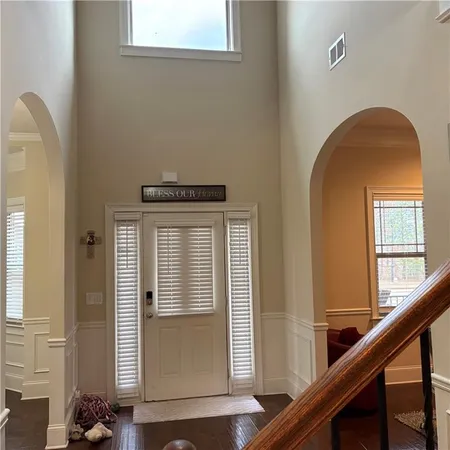 a view of front door with wooden floor