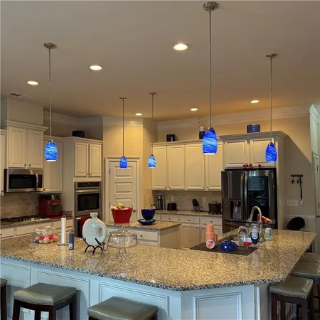 a kitchen with granite countertop lots of counter top space