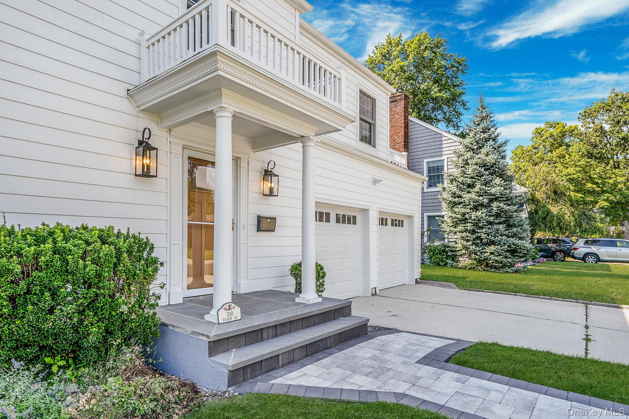 210 Roxbury Road Garden City, NY 11530 - Photo 1 of 1 a front view of a house with garden