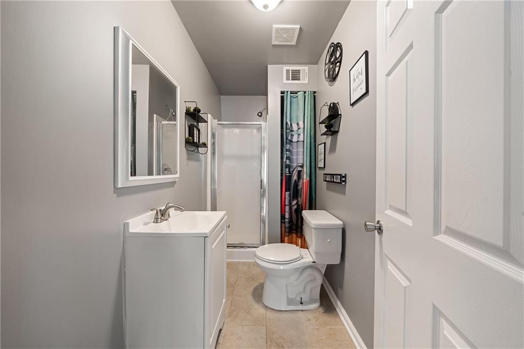 55 Meridian Point Dallas, GA 30132 - Photo 32 of 45 a bathroom with a toilet sink and mirror