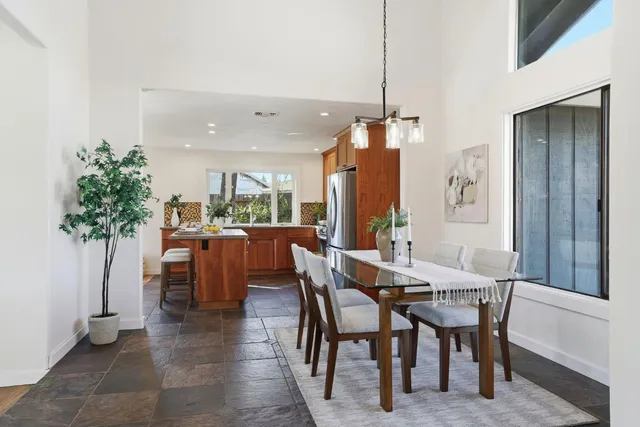 a kitchen with stainless steel appliances a refrigerator and a stove