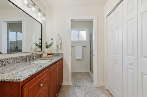 a view of a backyard with table and chairs