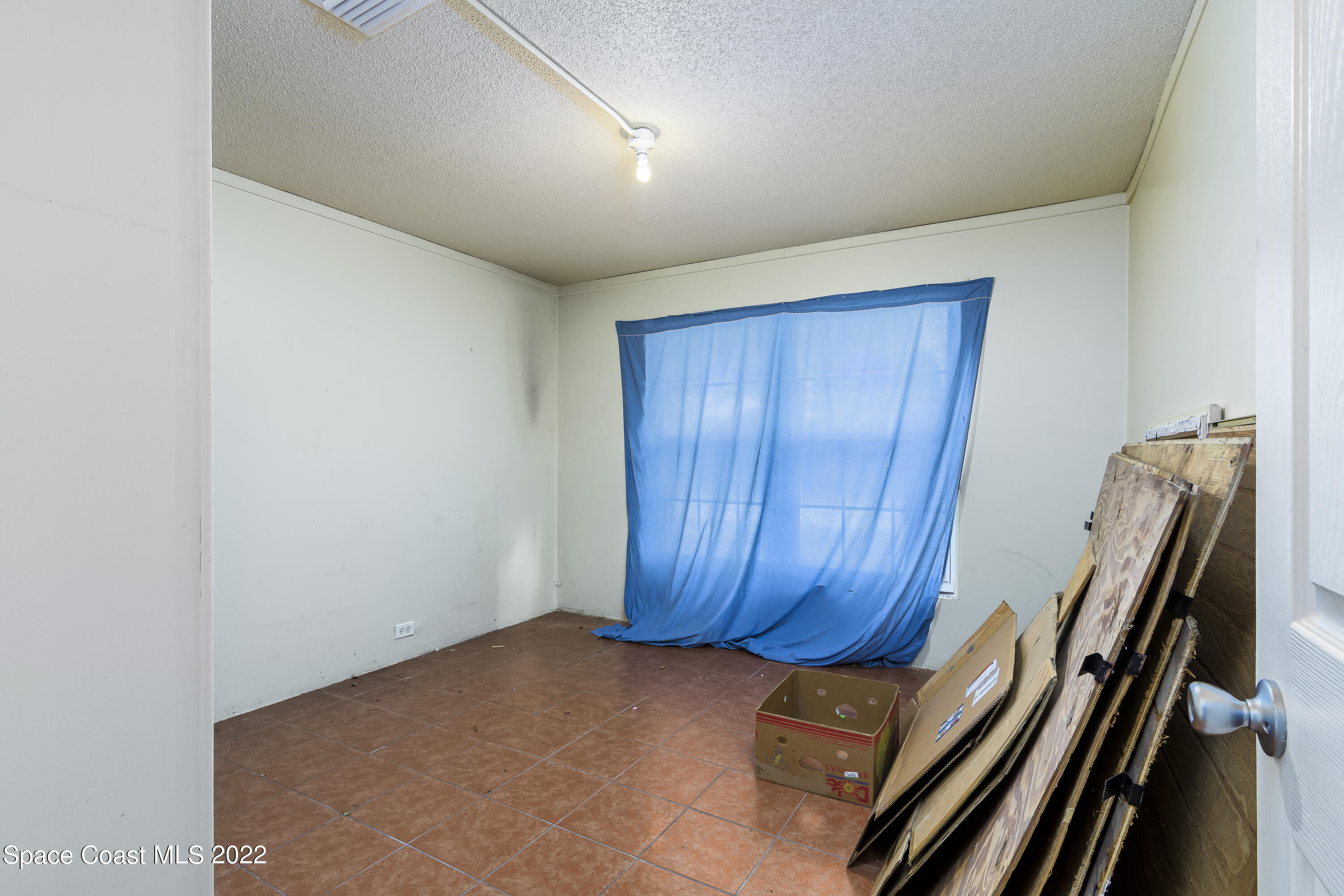 2389 Ricky Road Melbourne, FL 32935 - Photo 21 of 21 a view of a room with wooden walls