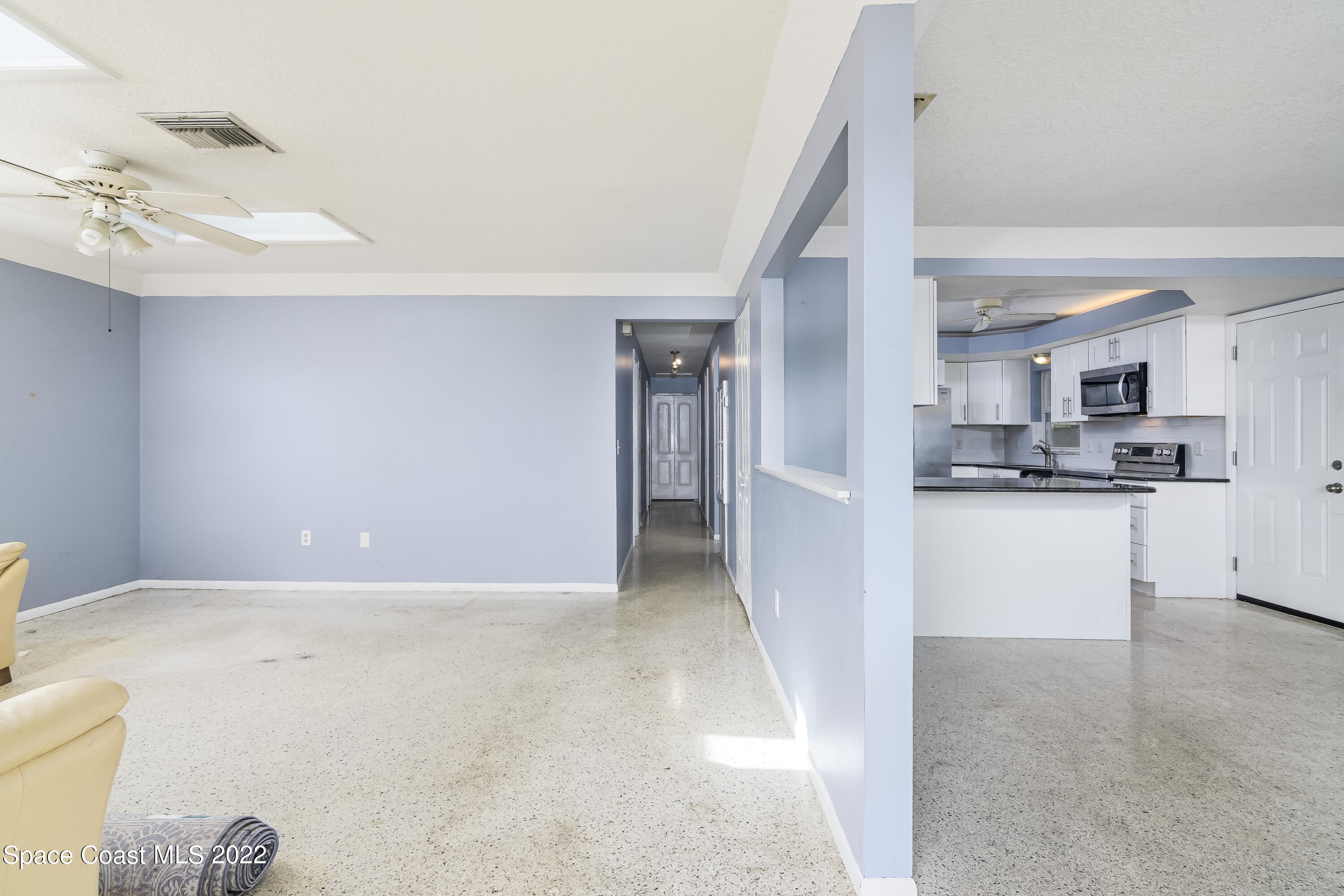2389 Ricky Road Melbourne, FL 32935 - Photo 3 of 21 a view of kitchen and kitchen with stainless steel appliances