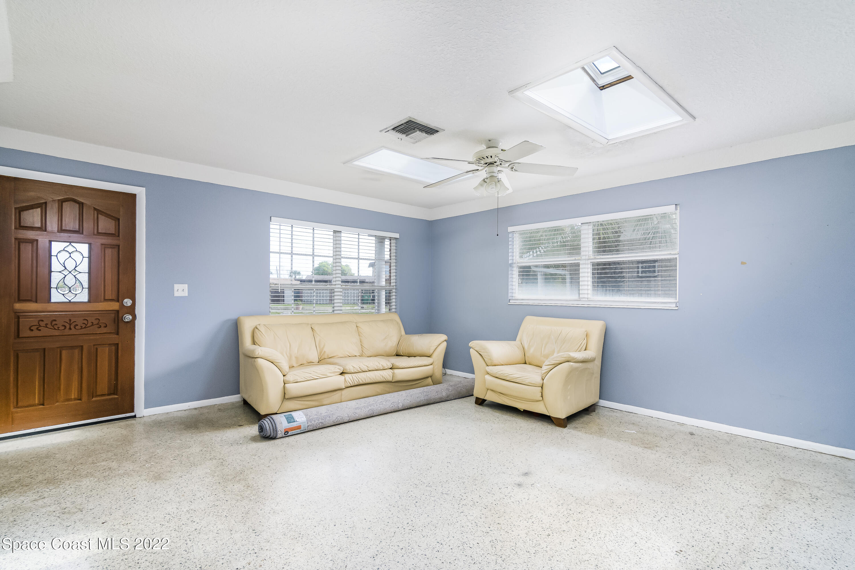 2389 Ricky Road Melbourne, FL 32935 - Photo 5 of 21 a living room with furniture and a window