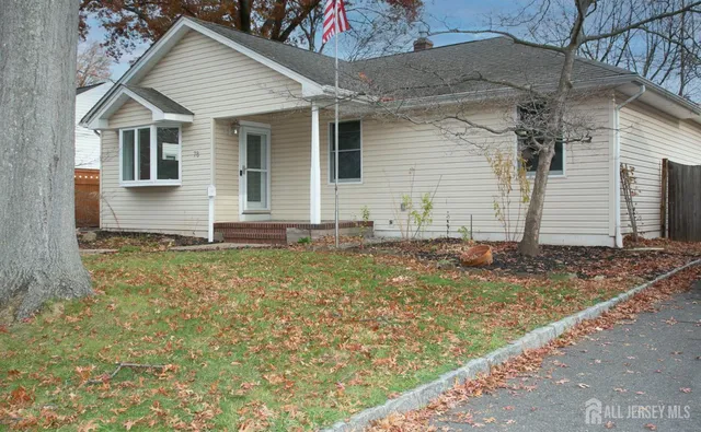 a view of a house with yard and chair