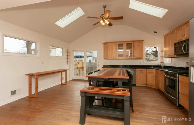 a kitchen with a stove and a microwave